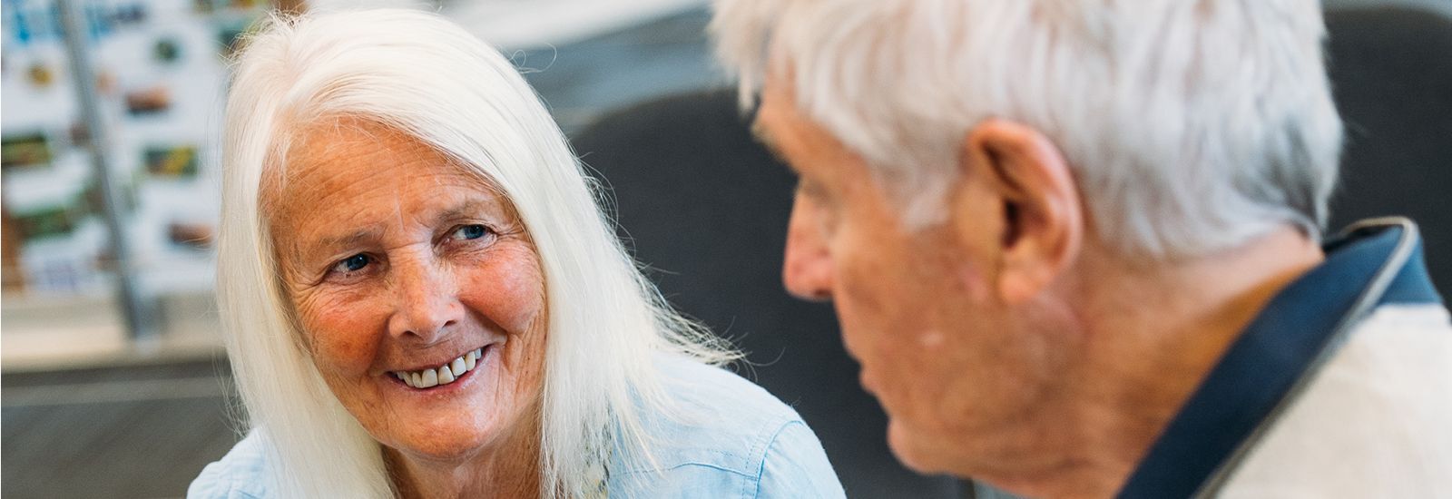 two seniors sitting together banner image