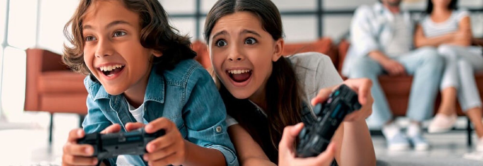 two children playing video games banner image