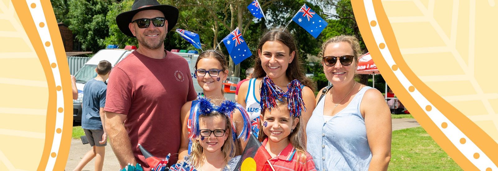 Family of four holding Australian flags banner image